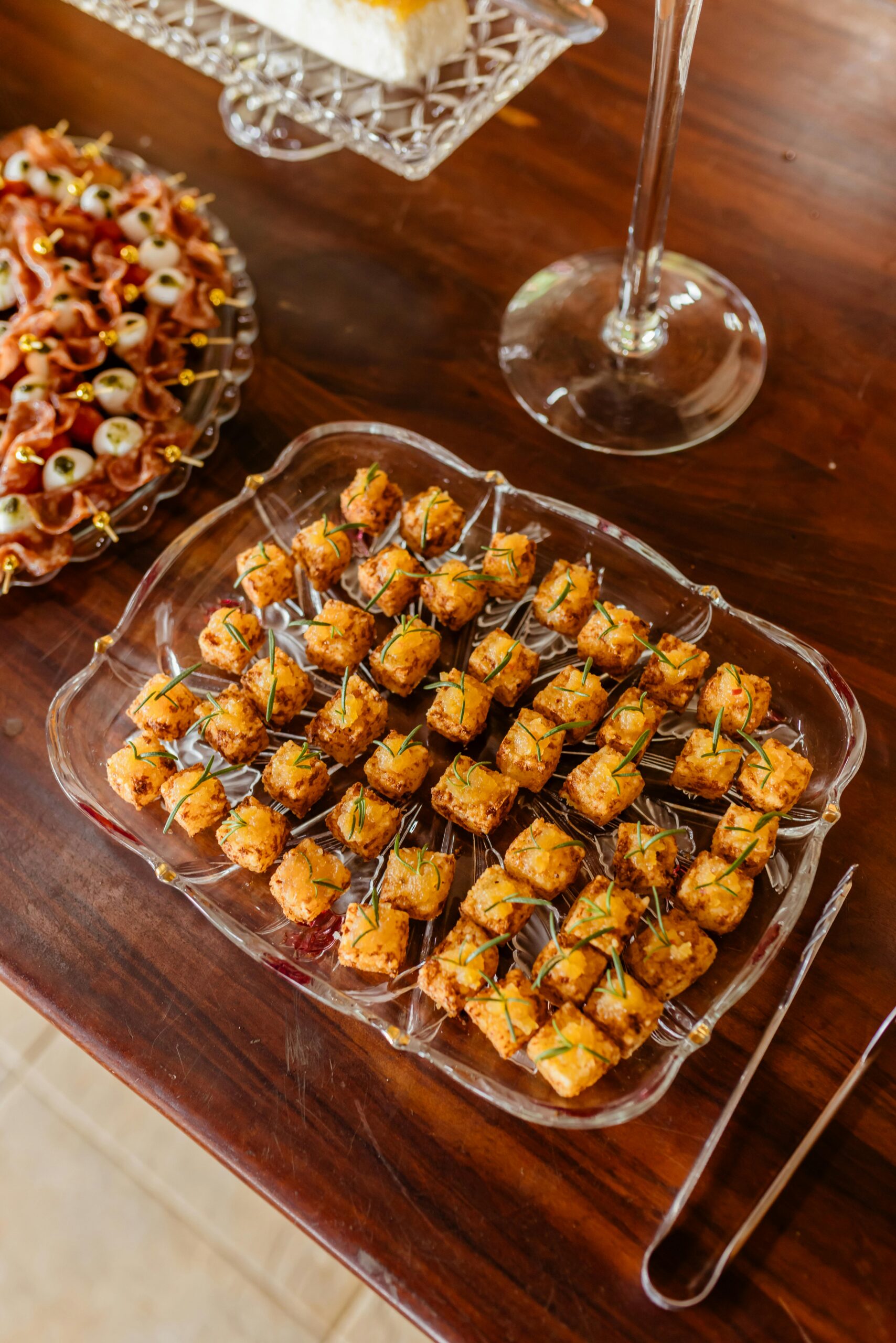 A tray of vegan appetizers on a wooden table, perfect for gatherings.